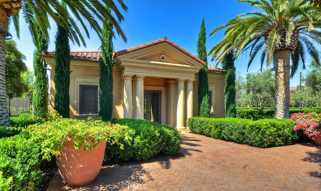 24 Tesoro, Irvine, CA 92618 - view of front of house with stucco siding and a tiled roof
