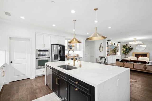 24 Tesoro, Irvine, CA 92618 - kitchen featuring stainless steel appliances, dark cabinets, white cabinetry, dark wood-type flooring, and recessed lighting
