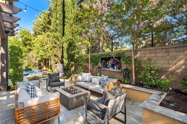 24 Tesoro, Irvine, CA 92618 - fenced backyard featuring an outdoor living space with a fire pit and a patio area
