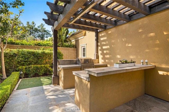 24 Tesoro, Irvine, CA 92618 - view of patio / terrace with exterior kitchen and a pergola
