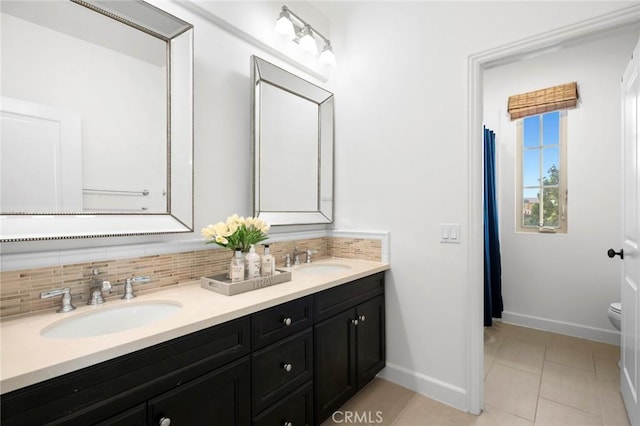 24 Tesoro, Irvine, CA 92618 - full bathroom featuring double vanity, decorative backsplash, and tile patterned floors