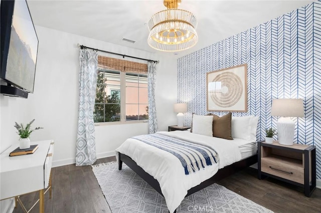 24 Tesoro, Irvine, CA 92618 - bedroom featuring an accent wall, wallpapered walls, a chandelier, and wood finished floors