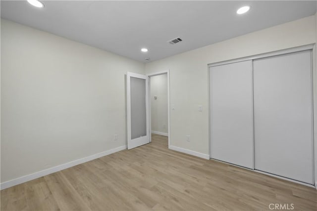 40635 159th St E, Lancaster, CA 93535 - unfurnished bedroom with wood finished floors, recessed lighting, and a closet