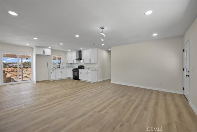 40635 159th St E, Lancaster, CA 93535 - unfurnished living room featuring recessed lighting and light wood-style flooring