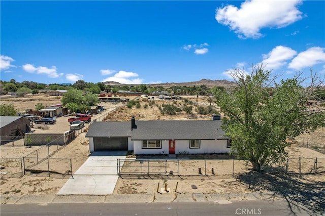 40635 159th St E, Lancaster, CA 93535 - view of front of property featuring concrete driveway, a mountain view, and a garage