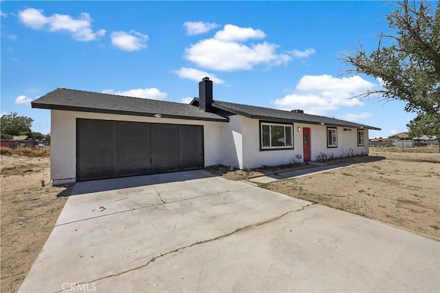 40635 159th St E, Lancaster, CA 93535 - single story home featuring a garage, driveway, a chimney, and stucco siding