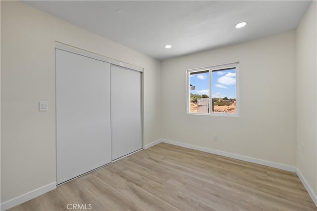 40635 159th St E, Lancaster, CA 93535 - unfurnished bedroom with light wood finished floors, a closet, and recessed lighting