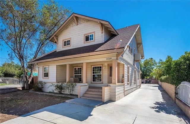 2626 5th St, Riverside, CA 92507 - view of front of property with a porch, concrete driveway, and a shingled roof