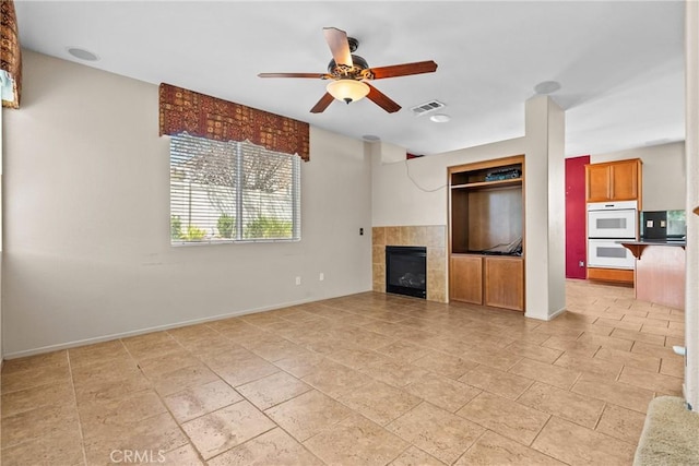 29513 Blake Way, Canyon Country, CA 91387 - unfurnished living room with ceiling fan and a tile fireplace