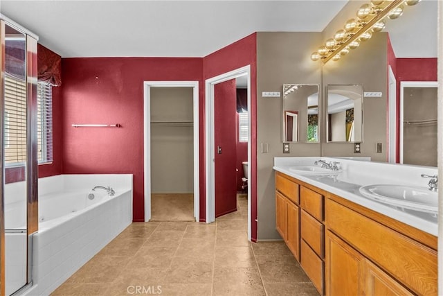 29513 Blake Way, Canyon Country, CA 91387 - bathroom featuring plenty of natural light, double vanity, a bath, and a walk in closet