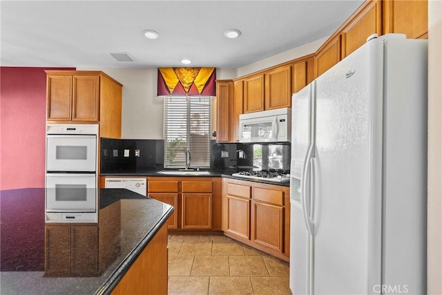 29513 Blake Way, Canyon Country, CA 91387 - kitchen featuring white appliances, backsplash, brown cabinets, recessed lighting, and dark stone counters