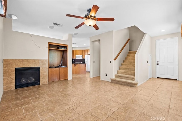 29513 Blake Way, Canyon Country, CA 91387 - unfurnished living room with a ceiling fan, stairway, recessed lighting, stone tile floors, and a fireplace