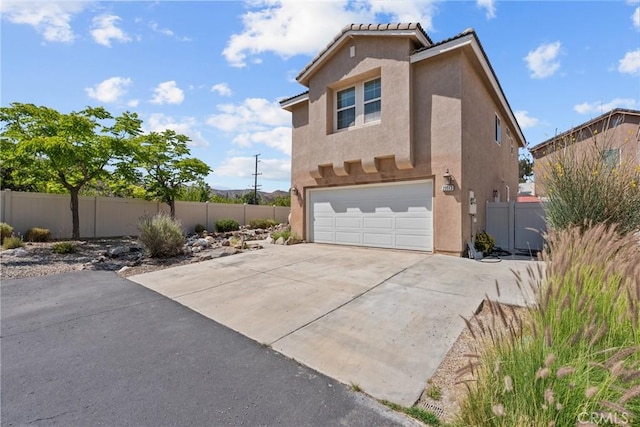 29513 Blake Way, Canyon Country, CA 91387 - view of home's exterior with an attached garage, stucco siding, and concrete driveway