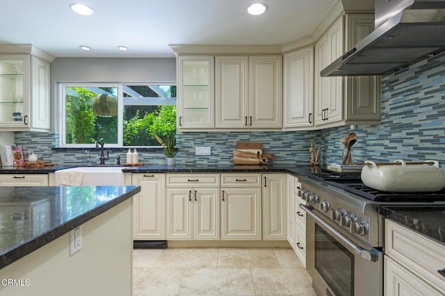 131 Christopher Ln, Ojai, CA 93023 - kitchen featuring high end stainless steel range, wall chimney exhaust hood, decorative backsplash, dark stone countertops, and recessed lighting