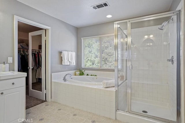 30336 Barcelona Rd, Castaic, CA 91384 - bathroom featuring vanity, a bath, a stall shower, and a spacious closet