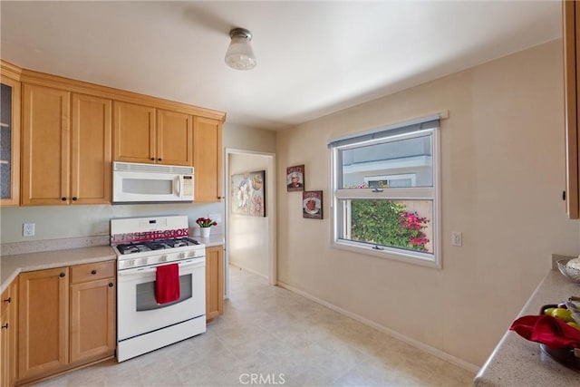 2012 Perry Ave, Redondo Beach, CA 90278 - kitchen with white appliances, light countertops, glass insert cabinets, and light flooring