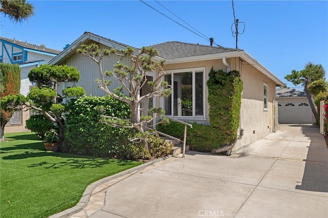 2012 Perry Ave, Redondo Beach, CA 90278 - view of side of home with a lawn, stucco siding, and an outdoor structure