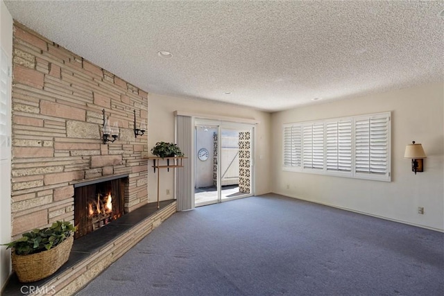 2012 Perry Ave, Redondo Beach, CA 90278 - unfurnished living room featuring carpet floors, a stone fireplace, and a textured ceiling