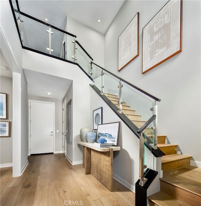 2626 Everly Dr, San Diego, CA 92108 - entryway with wood finished floors, stairs, and a towering ceiling