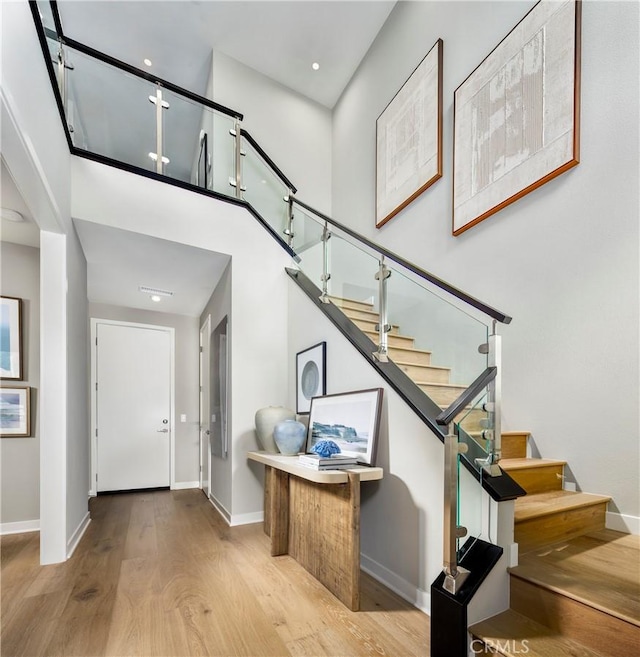 2626 Everly Dr, San Diego, CA 92108 - foyer featuring wood finished floors, stairs, and a high ceiling