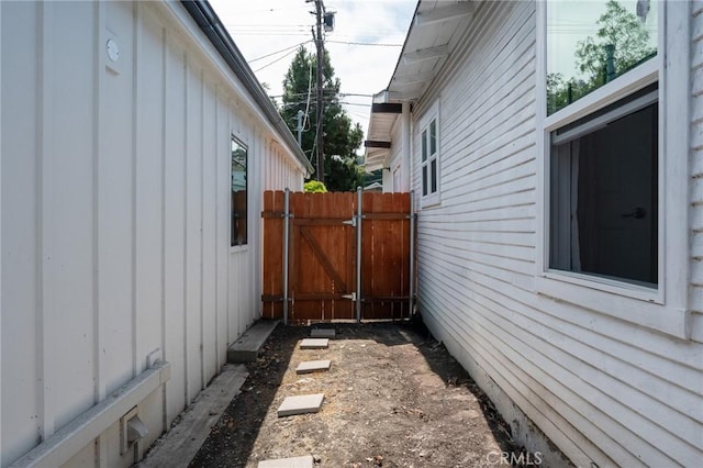 2848 S Kerckhoff Ave, San Pedro, CA 90731 - view of property exterior with board and batten siding and a gate