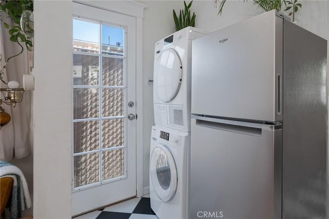 2848 S Kerckhoff Ave, San Pedro, CA 90731 - laundry area featuring stacked washer / drying machine and tile patterned floors