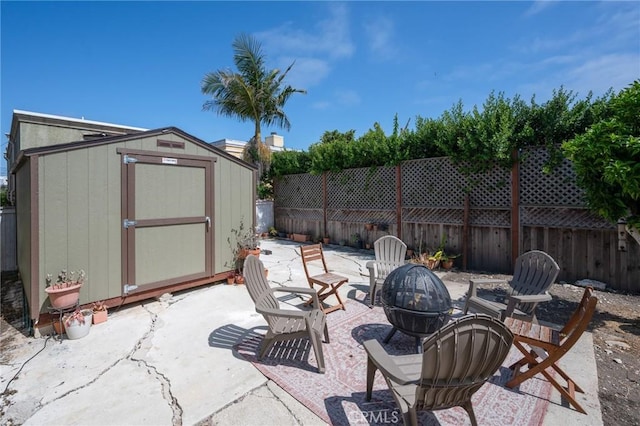 2848 S Kerckhoff Ave, San Pedro, CA 90731 - fenced backyard with an outdoor fire pit, a patio area, and a storage unit