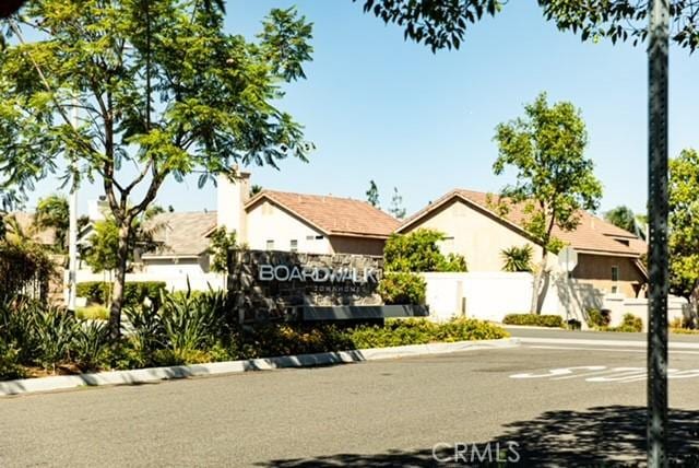1014 Savi Dr Unit 104, Corona, CA 92878 - view of property hidden behind natural elements with a chimney
