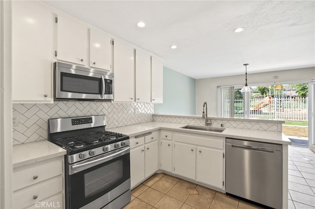19659 Monteano Ln, Yorba Linda, CA 92886 - kitchen featuring appliances with stainless steel finishes, a peninsula, light countertops, backsplash, and recessed lighting