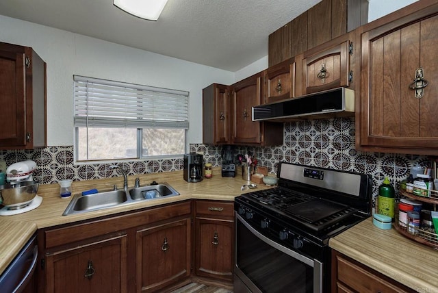 6743 Radio Dr, San Diego, CA 92114 - kitchen featuring stainless steel gas range oven, extractor fan, light countertops, tasteful backsplash, and a textured ceiling