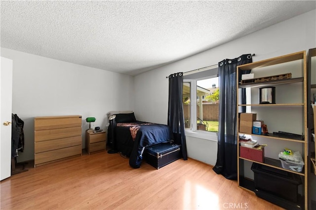 10415 Valley View Ave, Whittier, CA 90604 - bedroom featuring wood finished floors and a textured ceiling