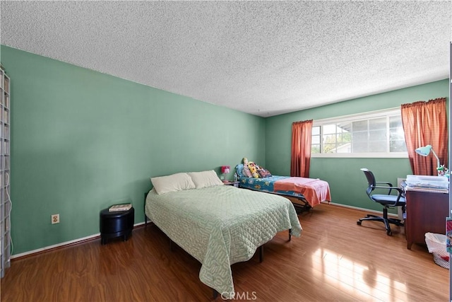 10415 Valley View Ave, Whittier, CA 90604 - bedroom featuring wood finished floors and a textured ceiling
