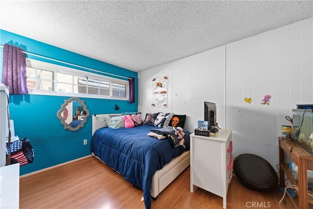 10415 Valley View Ave, Whittier, CA 90604 - bedroom featuring wood finished floors and a textured ceiling