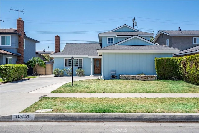 10415 Valley View Ave, Whittier, CA 90604 - traditional-style house with a chimney, a front yard, and driveway