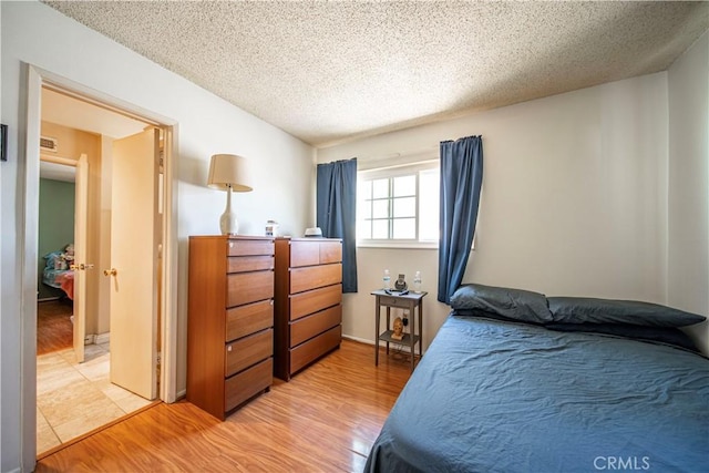 10415 Valley View Ave, Whittier, CA 90604 - bedroom with a textured ceiling and light wood-type flooring