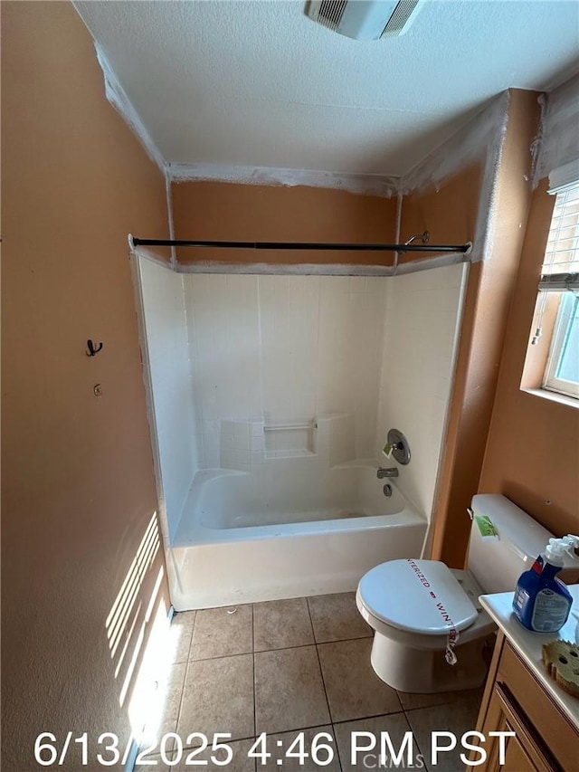 6921 Montego St, Chino, CA 91710 - bathroom with washtub / shower combination, tile patterned floors, vanity, and a textured ceiling