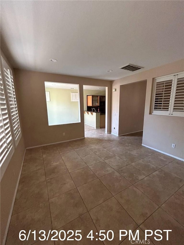 6921 Montego St, Chino, CA 91710 - spare room with dark tile patterned flooring and recessed lighting