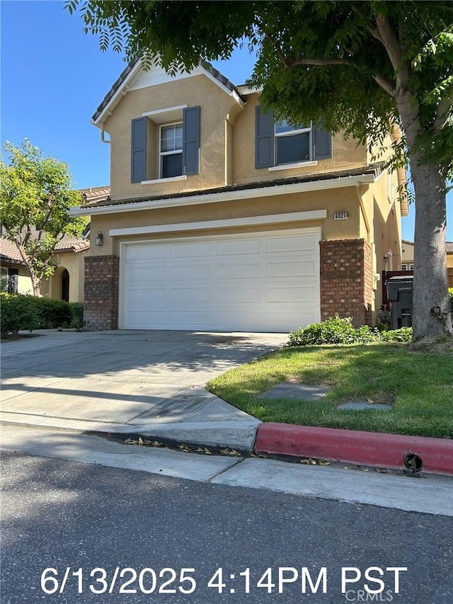 6921 Montego St, Chino, CA 91710 - traditional-style house with brick siding, stucco siding, an attached garage, concrete driveway, and a tiled roof