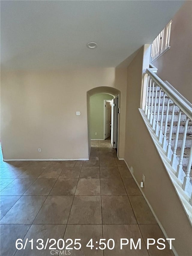 6921 Montego St, Chino, CA 91710 - empty room with arched walkways and tile patterned floors
