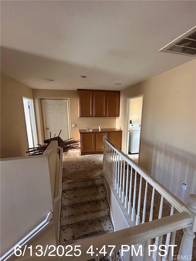 6921 Montego St, Chino, CA 91710 - staircase featuring washer / clothes dryer and carpet flooring