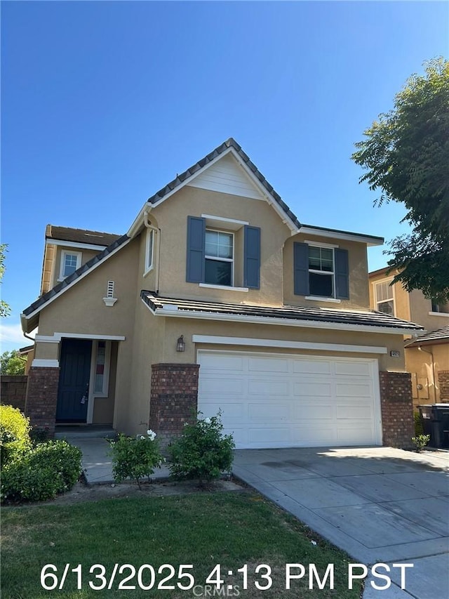 6921 Montego St, Chino, CA 91710 - traditional-style house with brick siding, an attached garage, stucco siding, and driveway