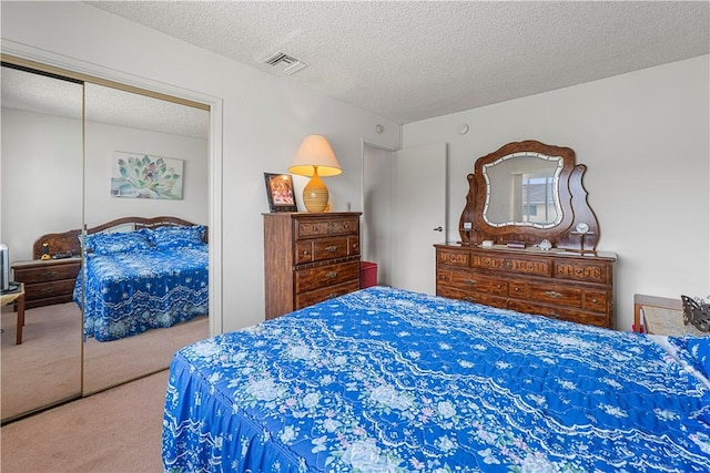 3500 W Manchester Blvd Unit 240, Inglewood, CA 90305 - bedroom with carpet floors, a textured ceiling, and a closet