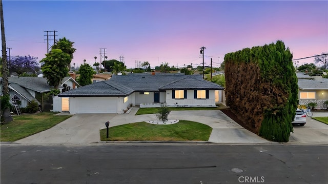 8771 La Grand Ave, Garden Grove, CA 92841 - ranch-style home with concrete driveway, a front lawn, a tiled roof, stucco siding, and a garage