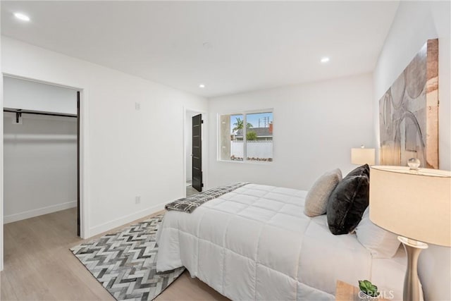 8771 La Grand Ave, Garden Grove, CA 92841 - bedroom with wood finished floors, recessed lighting, a closet, and a walk in closet