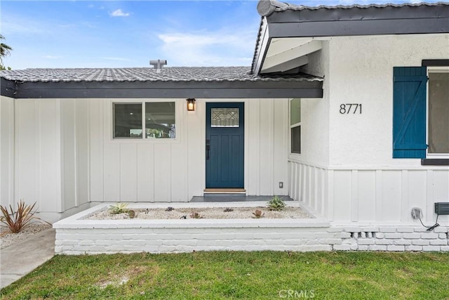 8771 La Grand Ave, Garden Grove, CA 92841 - doorway to property with board and batten siding