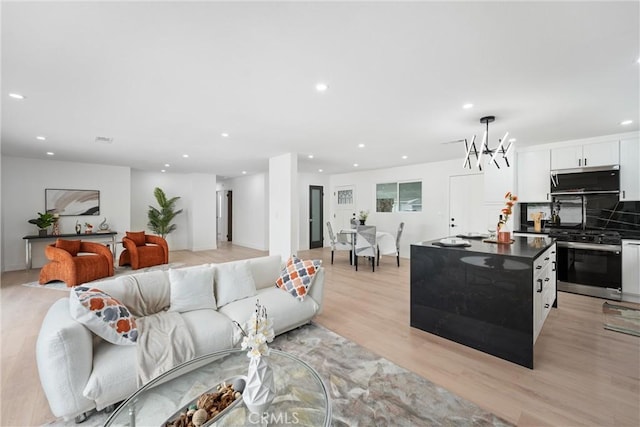8771 La Grand Ave, Garden Grove, CA 92841 - living area with recessed lighting, light wood-type flooring, and a chandelier