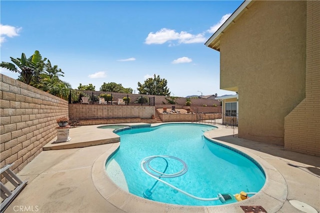 1142 Daisy Cir, Corona, CA 92882 - view of swimming pool featuring a fenced backyard, a patio area, and a pool with connected hot tub