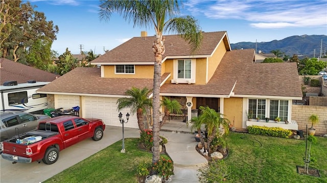 1142 Daisy Cir, Corona, CA 92882 - traditional home with stucco siding, a mountain view, concrete driveway, a front yard, and roof with shingles