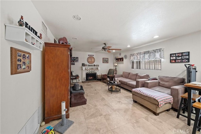 1142 Daisy Cir, Corona, CA 92882 - living area featuring ceiling fan, recessed lighting, and a brick fireplace