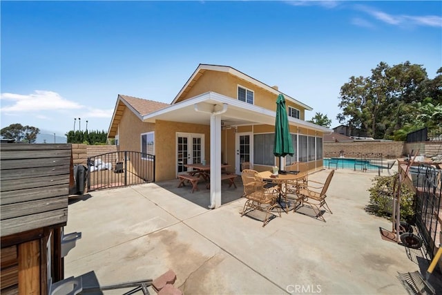 1142 Daisy Cir, Corona, CA 92882 - rear view of house with french doors, stucco siding, a patio, and a gate
